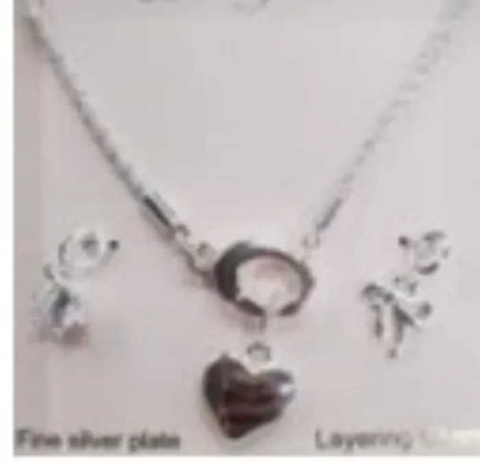 City by City Silver Plated Heart Charm Pendant Necklace With Bow Charm Made With Cubic Zirconia
